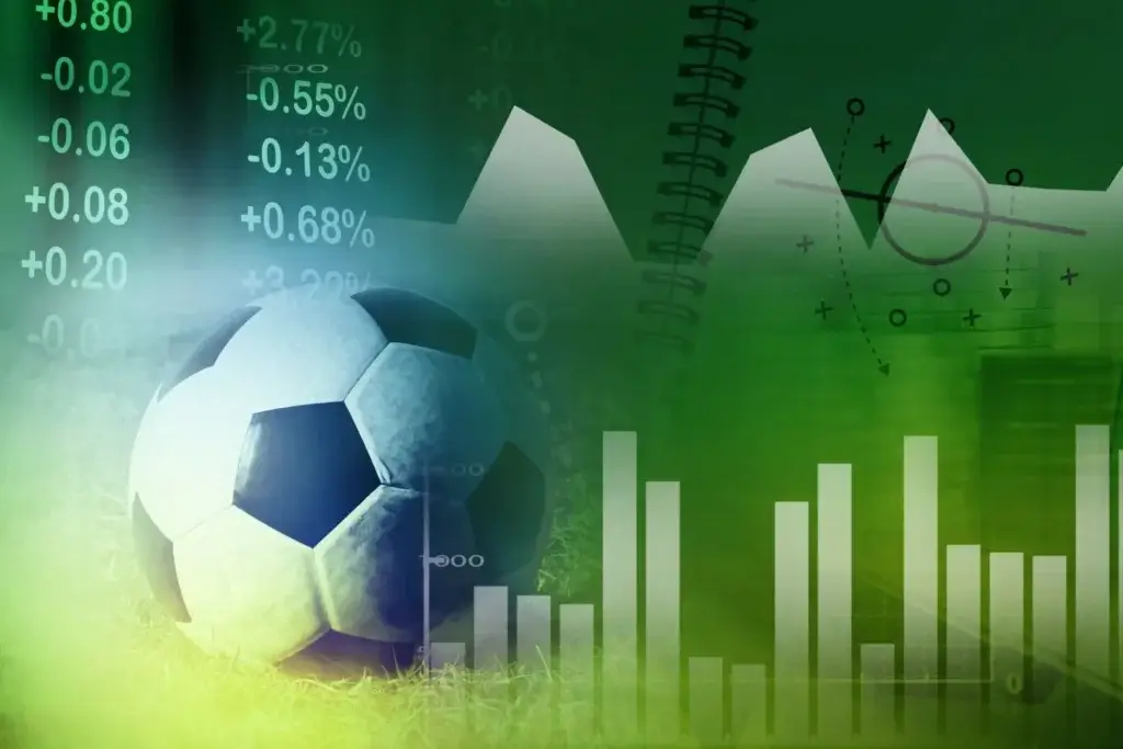 Fussball liegt auf Gras daneben ein Balkendiagramm, ein Notizbuch mit einer Sportwettenstrategie